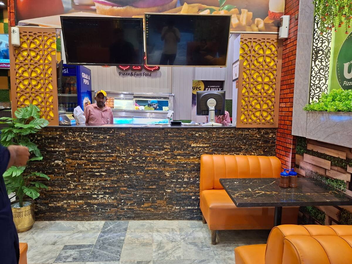 UFC Fast Food & Pizza interior brick wall seating