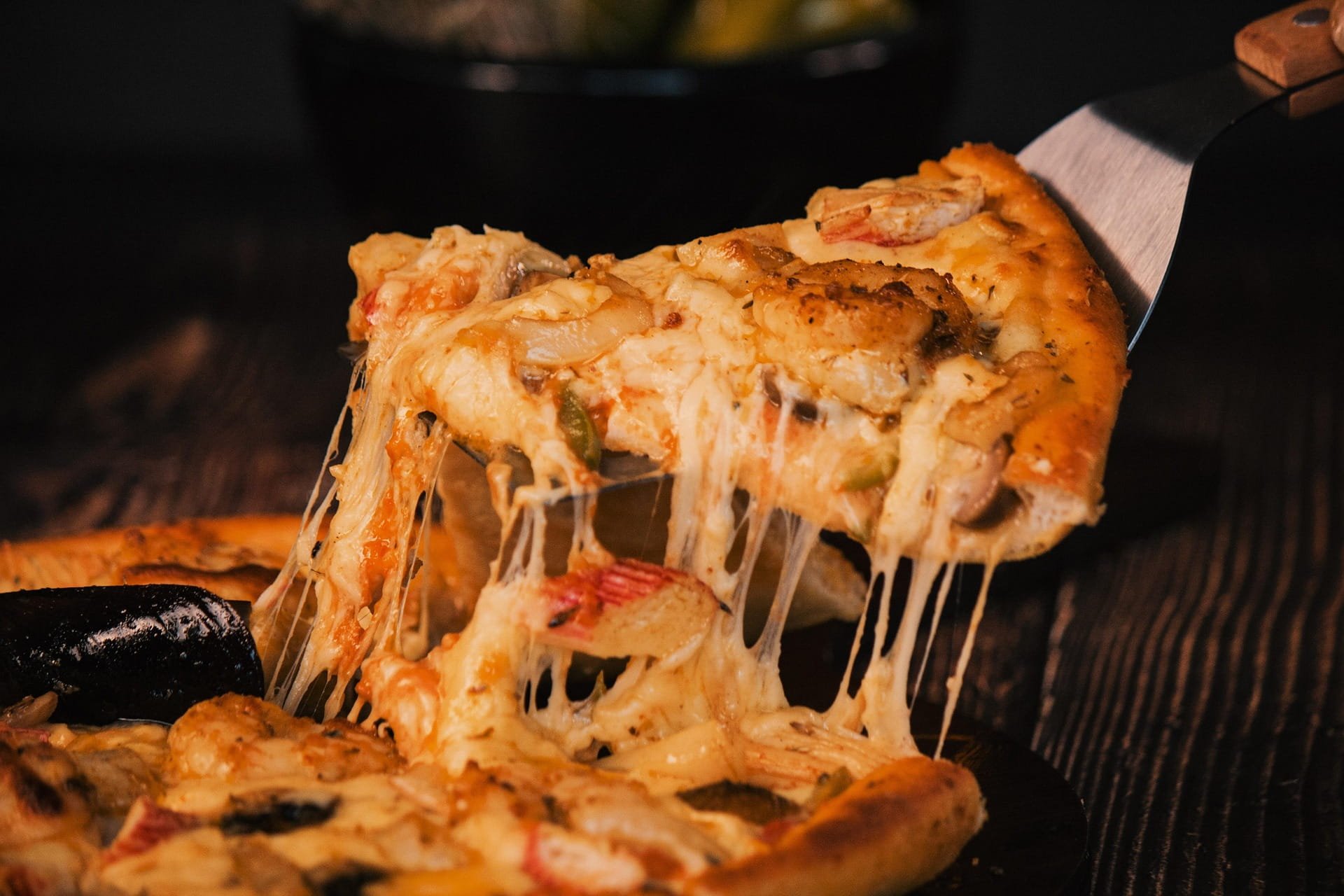 Fresh cheese pizza with toppings, ready to order
